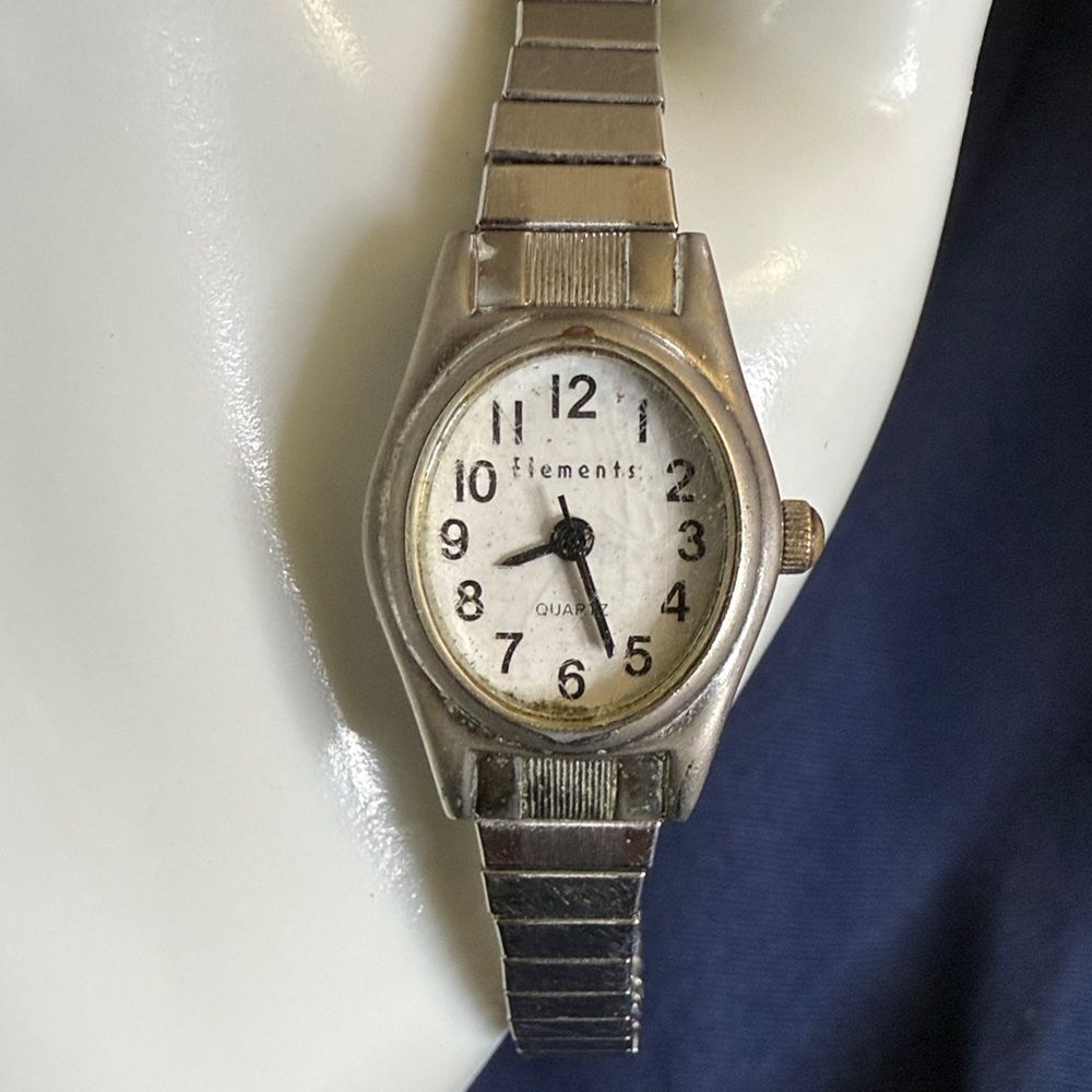 Vintage Elements Silver Women's Watch with new battery. Keeps great time.